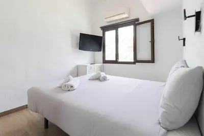 Cama o camas de una habitación en Sunset Bungalow
