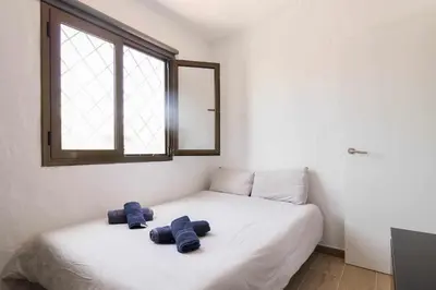 Cama o camas de una habitación en Sunset Bungalow