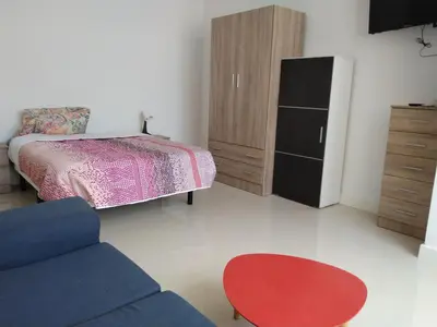 Cama o camas de una habitación en Edificio Triana St 47