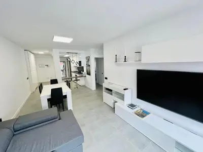 Una televisión o centro de entretenimiento en Apartamento Parque Jardín