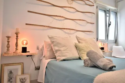 Cama o camas de una habitación en Viuter - Magna Home las Canteras Beach + Parking