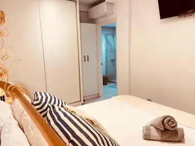 Cama o camas de una habitación en Viuter - Magna Home las Canteras Beach + Parking