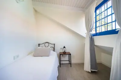 Cama o camas de una habitación en FABULOUS BUNGALOW , WIFI, SWIMMING POOL AND BEACH