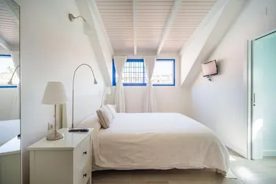 Cama o camas de una habitación en FABULOUS BUNGALOW , WIFI, SWIMMING POOL AND BEACH