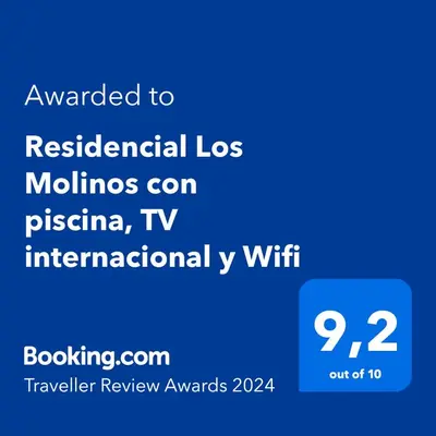 Certificado, premio, señal o documento que está expuesto en Residencial Los Molinos con piscina, TV internacional y Wifi