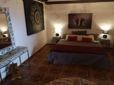 Cama o camas de una habitación en Suite Zen y Cueva Refugio