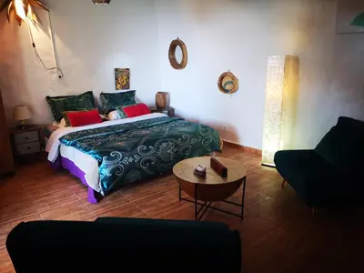 Cama o camas de una habitación en Suite Zen y Cueva Refugio