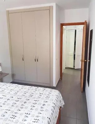 Cama o camas de una habitación en Happy Arimar Apartments Puerto Rico