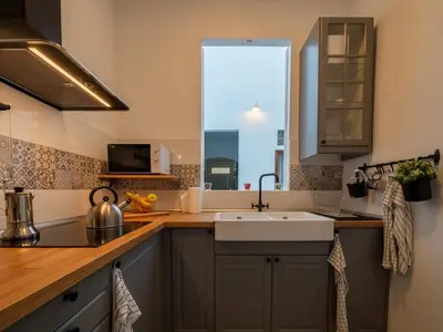 Una cocina o zona de cocina en El Rincón de los Artistas