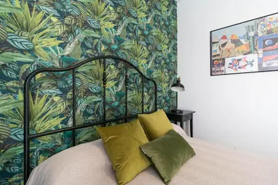 Cama o camas de una habitación en El Rincón de los Artistas