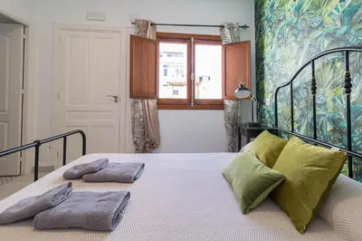 Cama o camas de una habitación en El Rincón de los Artistas