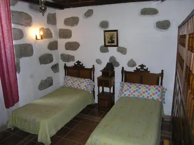 Cama o camas de una habitación en Vivelorural - La Casita de Andrés 1 en Agüimes