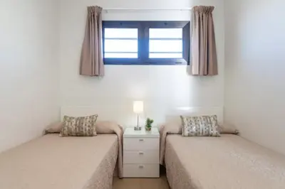 Cama o camas de una habitación en Apartamentos Liszt