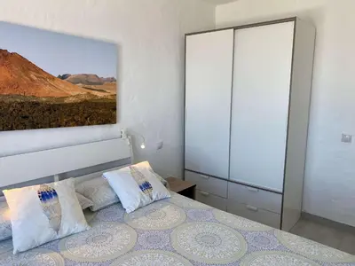 Cama o camas de una habitación en Casa Aita - refurbished apartment with unparalleled sea view