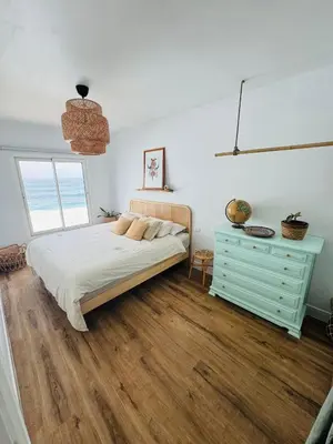 Cama o camas de una habitación en Cá Xuxù Precioso ático en primera línea de mar