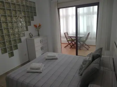 Cama o camas de una habitación en Acogedor apartamento en primera línea de playa Las Canteras