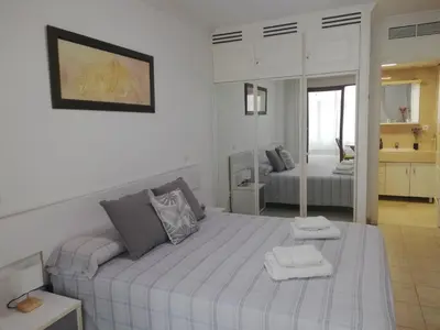 Cama o camas de una habitación en Acogedor apartamento en primera línea de playa Las Canteras