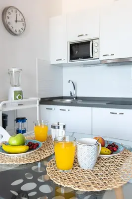 Una cocina o zona de cocina en Home2Book Cozy Apartment Beach Front Las Canteras