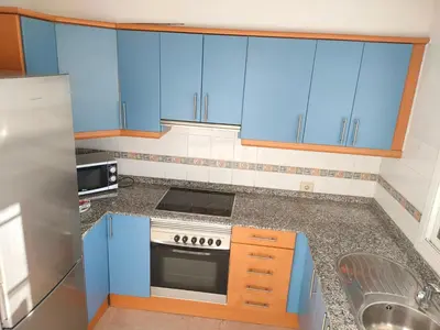 Una cocina o zona de cocina en Comfortable modern house with jacuzzi, and access to swimming pool