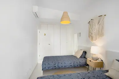 Cama o camas de una habitación en Luxury Boho Villa with Heated Pool, Rooftop and Panoramic Sea View in Amadores