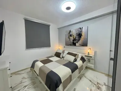 Cama o camas de una habitación en Piso Canteras/2 Bedroom+Balcony+Parking at Beach