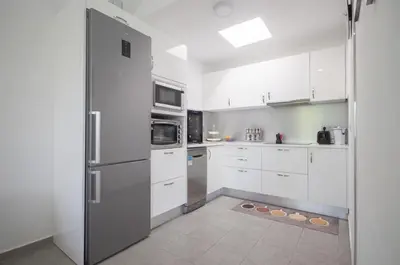 Una cocina o zona de cocina en Charming bungalow with private garden