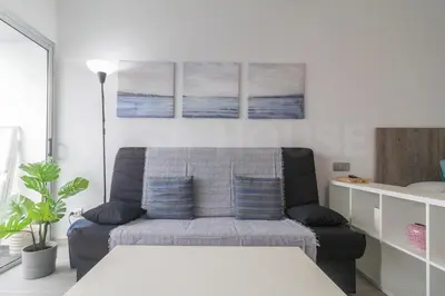 Zona de estar de Moderno Estudio con terraza en Las Canteras
