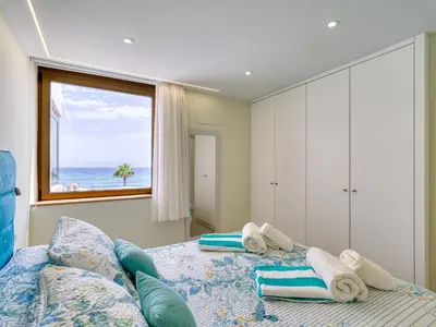 Cama o camas de una habitación en Precioso apartamento en 1ª línea de mar