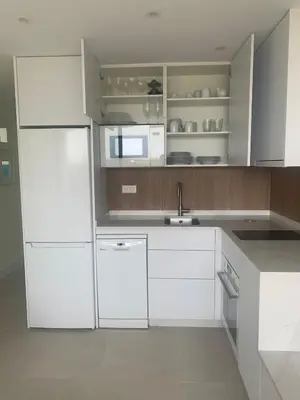 Una cocina o zona de cocina en Precioso apartamento en 1ª línea de mar