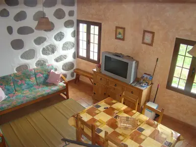 Una televisión o centro de entretenimiento en Casa Rural Paisajes de Tejeda