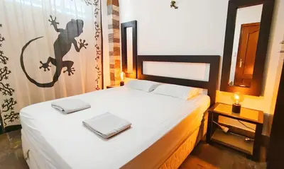 Cama o camas de una habitación en Lizards Lounge - Tanife Apartment beim Yumbo