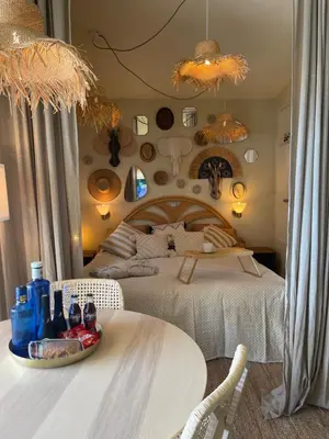 Cama o camas de una habitación en Boho style bungalow with ocean view