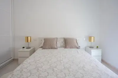 Cama o camas de una habitación en Flatguest Las Canteras Beach 10 + Wifi + 5 Pax