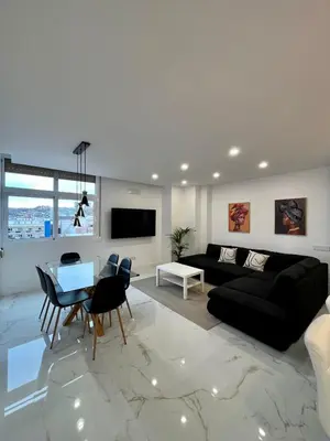 Una televisión o centro de entretenimiento en Apartamento Casa Blanca