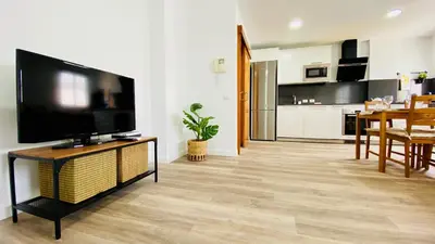 Una televisión o centro de entretenimiento en Suite Dream Capricho