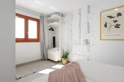 Cama o camas de una habitación en Vegueta Rooftop Suites by Airnest