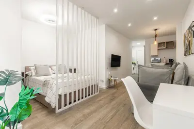 Cama o camas de una habitación en Nomad, Wifi , Espacio trabajo ,Playa ,Ocio