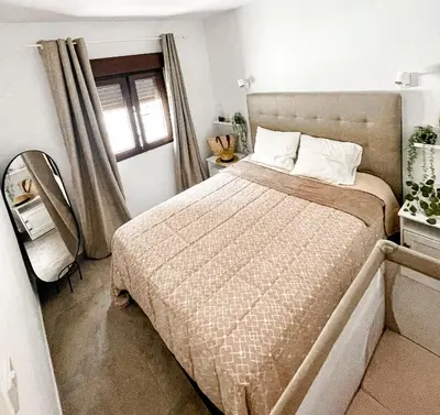 Cama o camas de una habitación en Rosa Amarilla Apartment