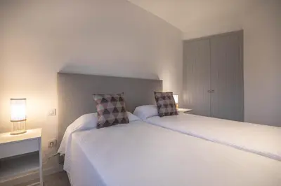 Cama o camas de una habitación en Bungalow en San Agustín 