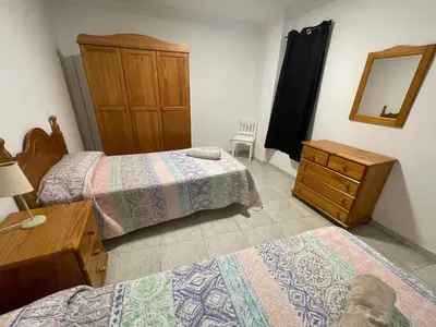 Cama o camas de una habitación en Apartamento Playa I & II Arinaga