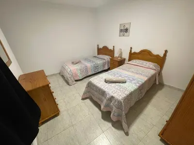 Cama o camas de una habitación en Apartamento Playa I & II Arinaga