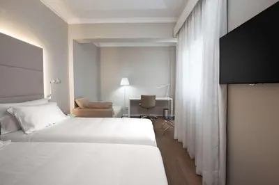 Cama o camas de una habitación en NH Las Palmas Playa las Canteras