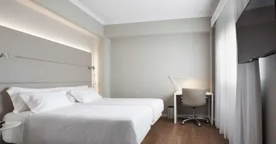 Cama o camas de una habitación en NH Las Palmas Playa las Canteras