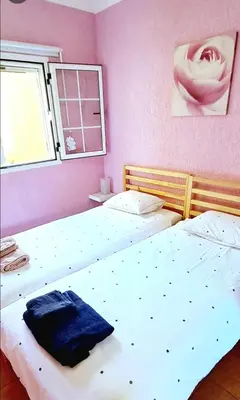 Cama o camas de una habitación en Nice Apartment with Swimmingpool, Wifi and Free Parking in Arguineguin