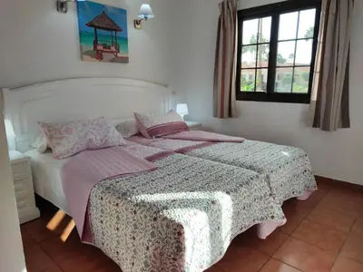 Cama o camas de una habitación en Bungalow Santa Fe bien ubicado