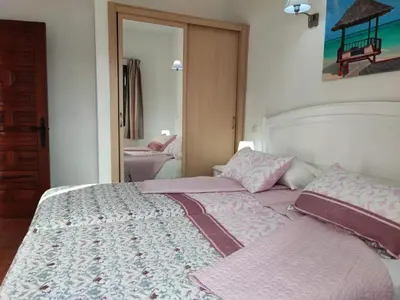 Cama o camas de una habitación en Bungalow Santa Fe bien ubicado