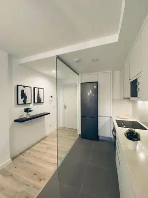Una cocina o zona de cocina en Acogedor y cómodo apartamento con piscina