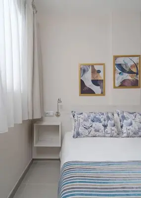 Cama o camas de una habitación en Las Afortunadas - Playa Arinaga 1ºB