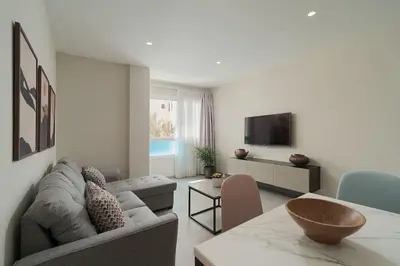 Una televisión o centro de entretenimiento en Las Afortunadas - Playa Arinaga 1ºB