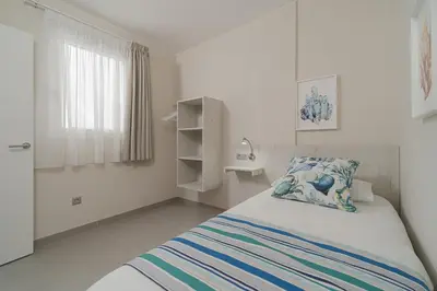 Cama o camas de una habitación en Las Afortunadas - Playa Arinaga 2ºC
